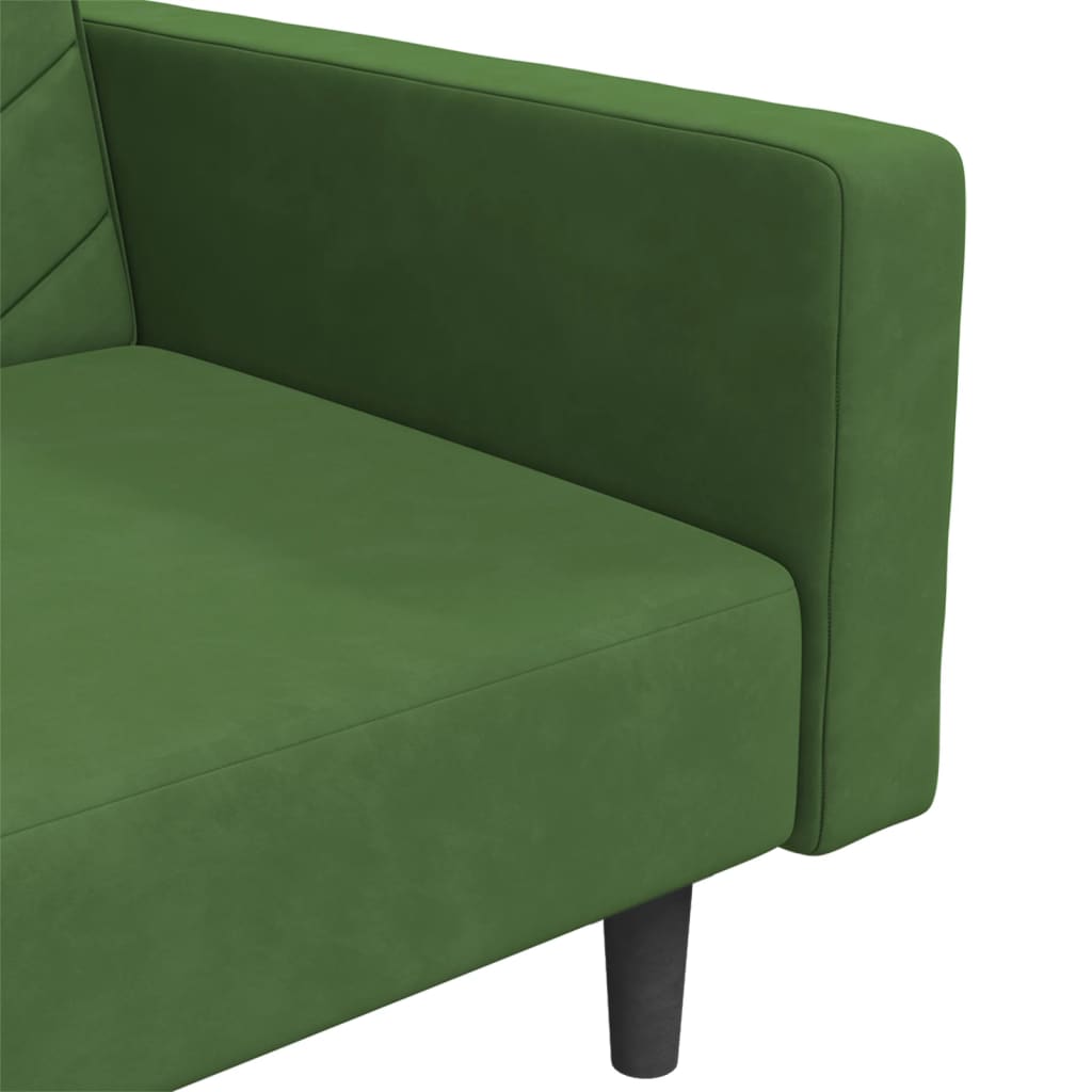 2-seater sofa bed with two dark green velvet cushions