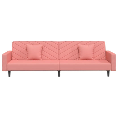 2-seater sofa bed with two pink velvet cushions