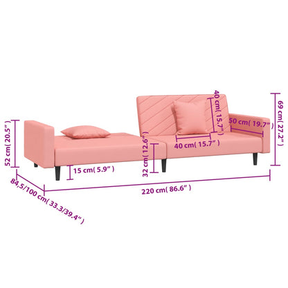 2-seater sofa bed with two pink velvet cushions
