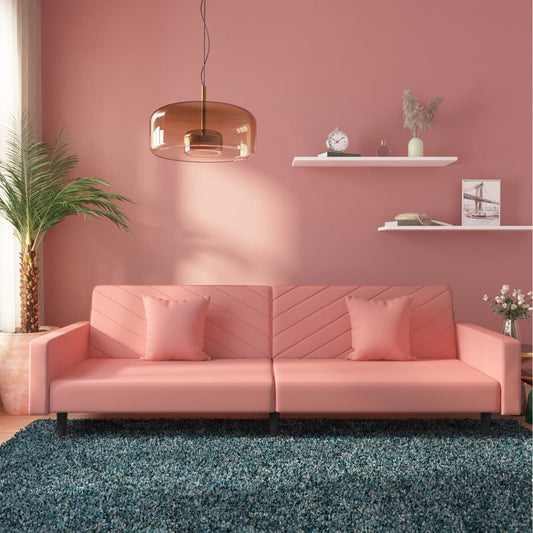 2-seater sofa bed with two pink velvet cushions