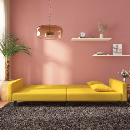 2-seater sofa bed with two yellow velvet cushions