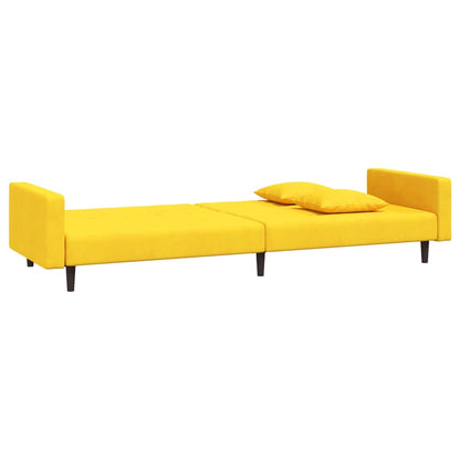 2-seater sofa bed with two yellow velvet cushions