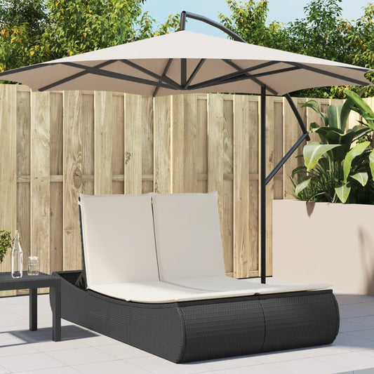 Double sun lounger with cushions in black poly rattan
