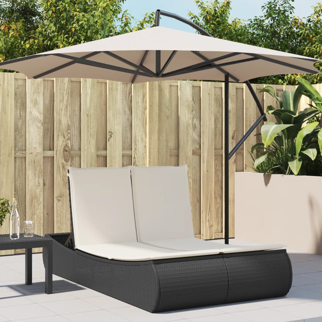 Double sun lounger with cushions in black poly rattan