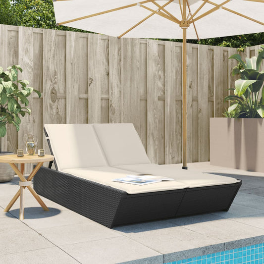 Double sun lounger with cushions in black poly rattan