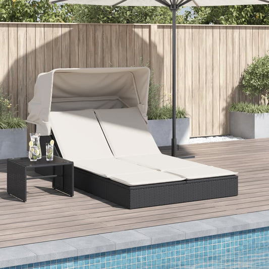 Double sun lounger with canopy and cushions in black poly rattan